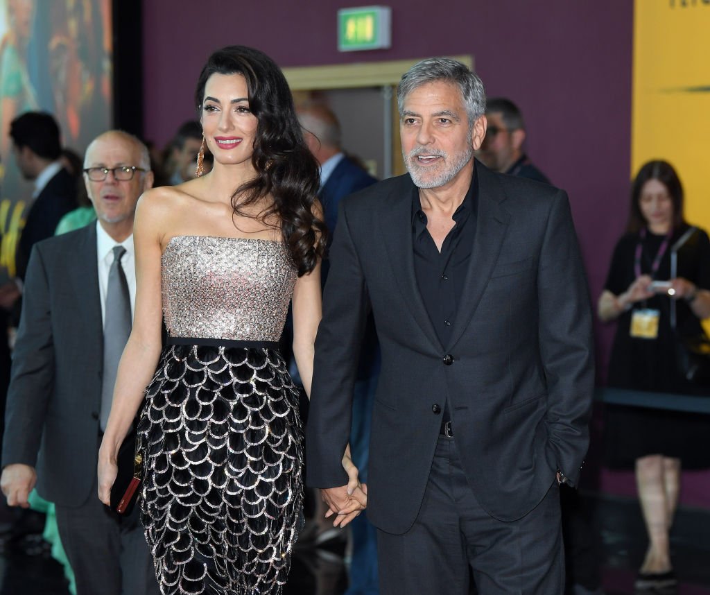Image Credit: Getty Images / Amal Clooney and George Clooney attend the "Catch 22" UK premiere at the Vue Westfield on May 15, 2019 in London, United Kingdom. Image Credit: Getty Images / Amal Clooney and George Clooney attend the "Catch 22" UK premiere at the Vue Westfield on May 15, 2019 in London, United Kingdom.