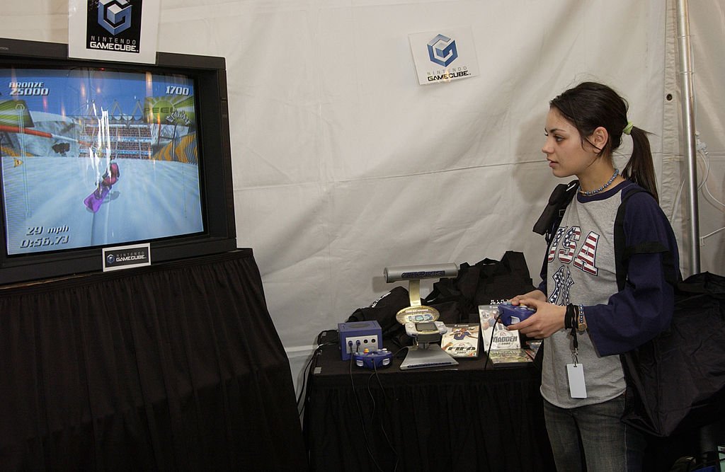 Image Credit: Getty Images / Mila Kunis playing Electronic Arts games on Nintendo. Image Credit: Getty Images / Mila Kunis playing Electronic Arts games on Nintendo.