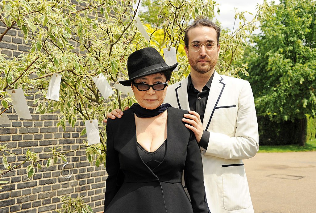 Image Credits: Getty Images / Dave M. Benett | Yoko Ono (L) and Sean Lennon pose during a photocall launching Yoko Ono's exhibition 'To The Light' at The Serpentine Gallery on June 18, 2012 in London, England.