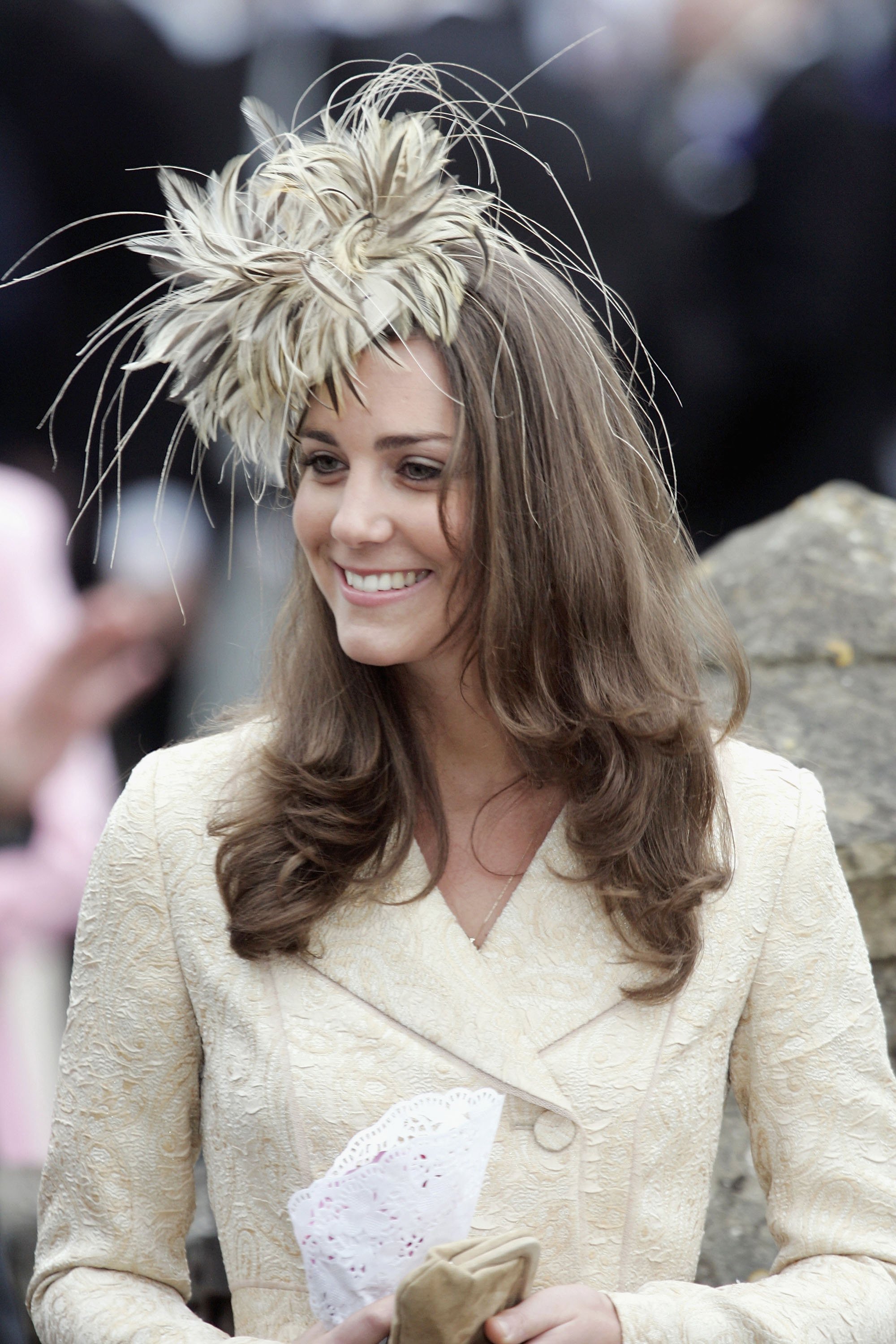 Image Source: Getty Images/Kate Middleton wearing a cream embroidered blazer and a matching hat