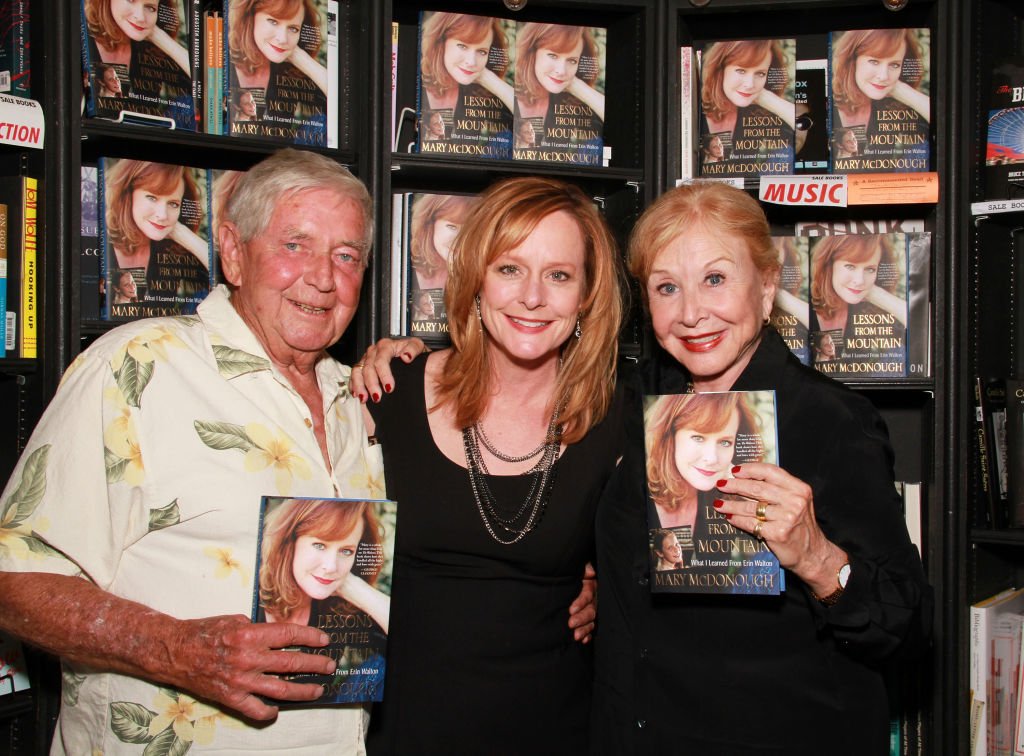 Image Credits: Getty Images / Brian Putnam | (L-R) Actors Ralph Waite, Mary McDonough and Michael Learned attend the signing of Mary McDonough's book 'Lessons From the Mountain: What I Learned From Erin Walton' at Book Soup on April 16, 2011 in West Hollywood, California.