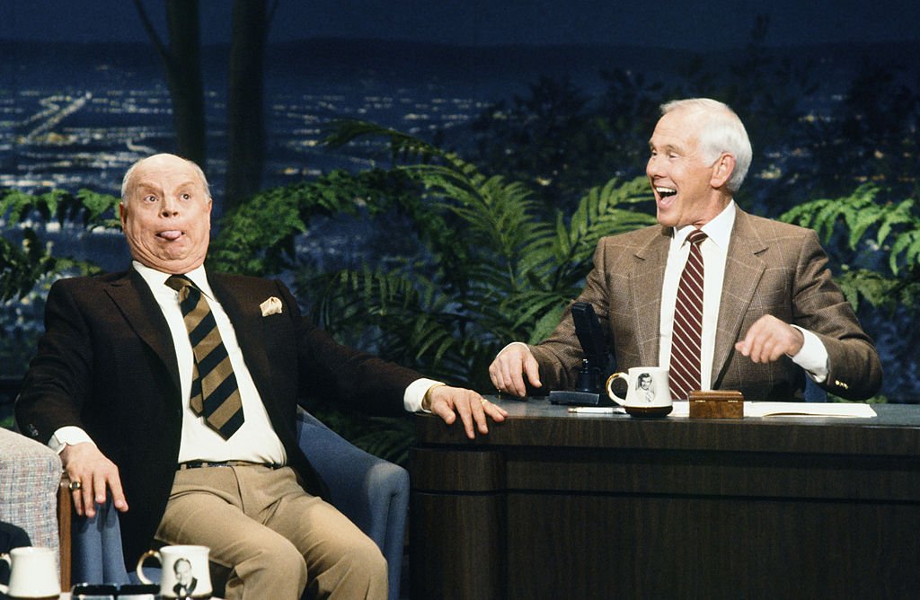 Image Credits: Getty Images / Chris Haston / NBCU Photo Bank / NBCUniversal | Comedian/actor Don Rickles, host Johnny Carson on February 7, 1990.