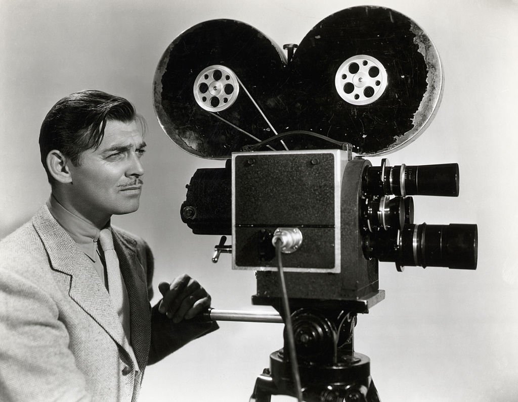 Image Credit: Getty Images / Clark Gable in a publicity photograph for his film Too Hot to Handle, 1938 in which he plays a newsreel reporter. Image Credit: Getty Images / Clark Gable in a publicity photograph for his film Too Hot to Handle, 1938 in which he plays a newsreel reporter.