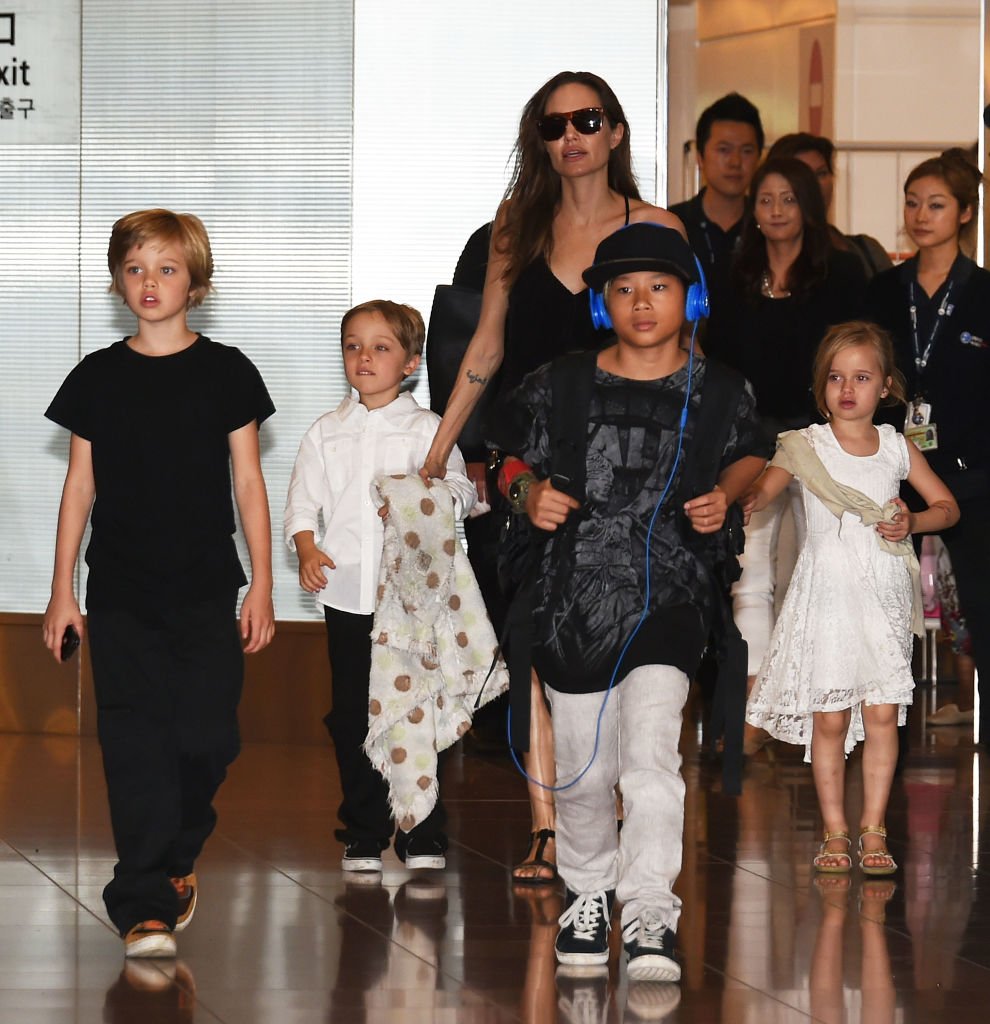 Image Source: Getty Images/Jun Sato/Shiloh Jolie-Pitt, Knox Jolie-Pitt, Angelina Jolie, Pax Jolie-Pitt and Vivienne Jolie-Pitt are seen upon arrival at Haneda Airport on June 21, 2014 in Tokyo, Japan