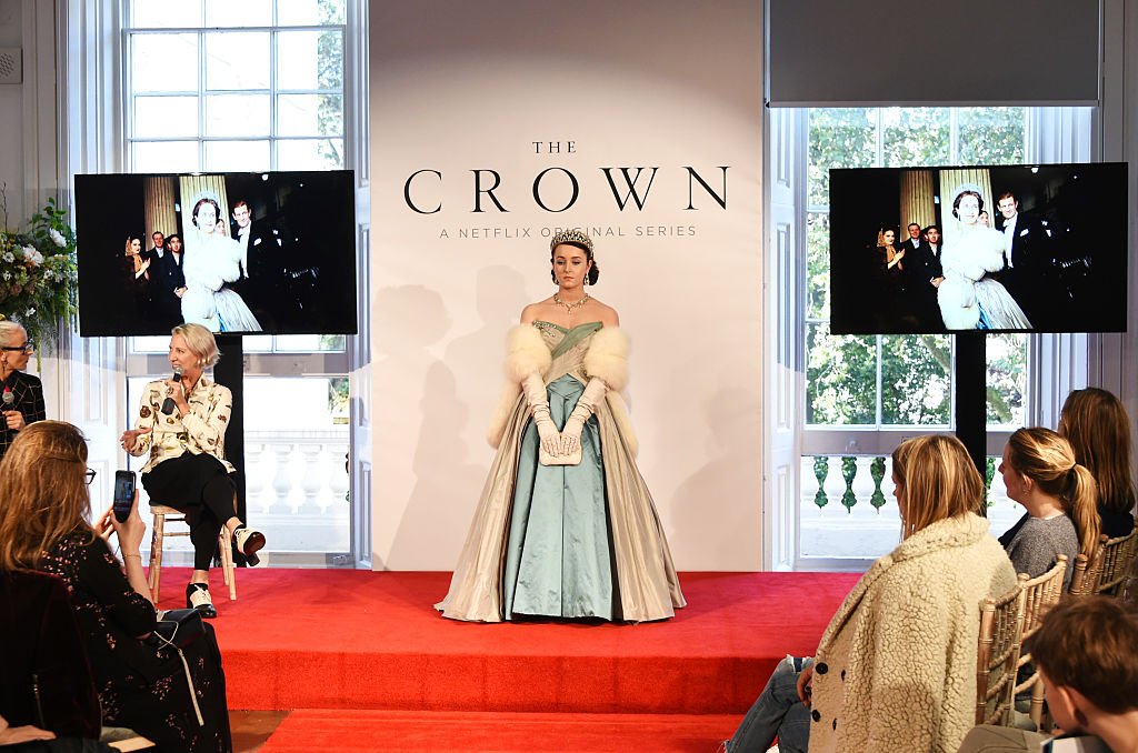 Image Credits: Getty Images / David M. Benett / Dave Benett | Caryn Franklin (L) and Michele Clapton speak as a model poses at a presentation featuring costumes from new Netflix Original series "The Crown" with designer Michele Clapton at the ICA on October 17, 2016 in London, England.