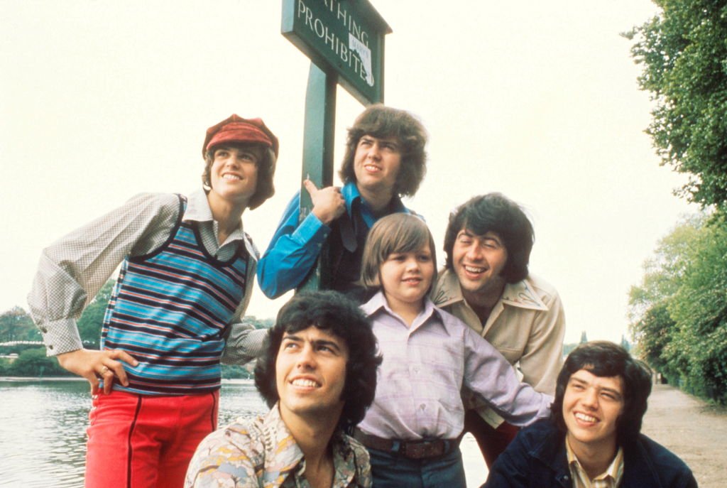 Image Credit: Getty Images / The Osmonds, group portrait, London, 1973, L-R (back) Donny Osmond, Merrill Osmond, (front) Alan Osmond, Jimmy Osmond, Wayne Osmond, Jay Osmond.