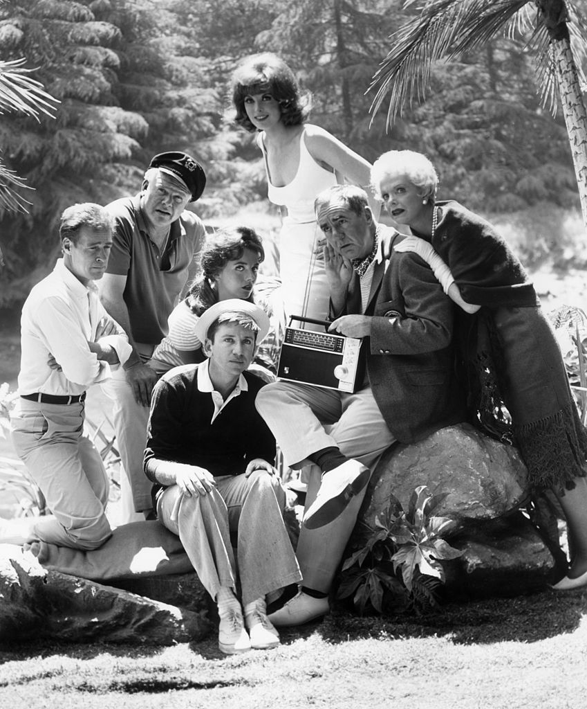 Image Source: Getty Images/Hulton Archive/The cast of the television comedy series, 'Gilligan's Island,' which ran from 1964-1967, listens to a short wave radio outdoors in a promotional portrait