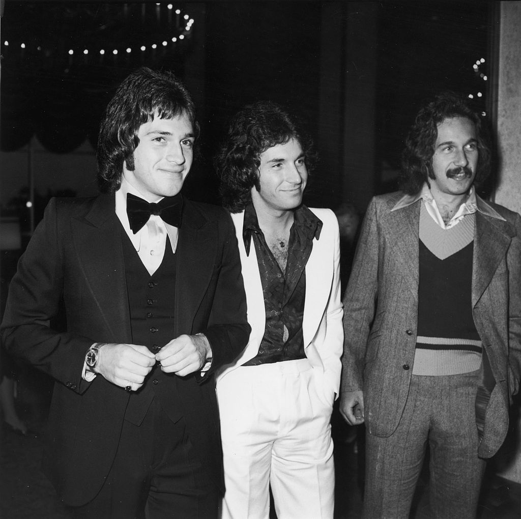 Image Credits: Getty Images / Frank Edwards / Fotos International | American pop group The Hudson Brothers (left to right): Brett, Bill, and Mark at a CBS convention promoting their television show, May 1974.