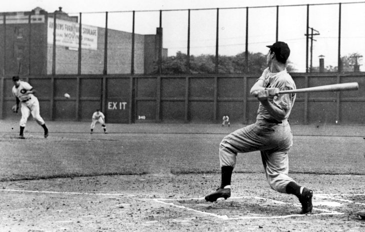 Image Credit: Getty Images / Joe DiMaggio playing baseball with his teammates.