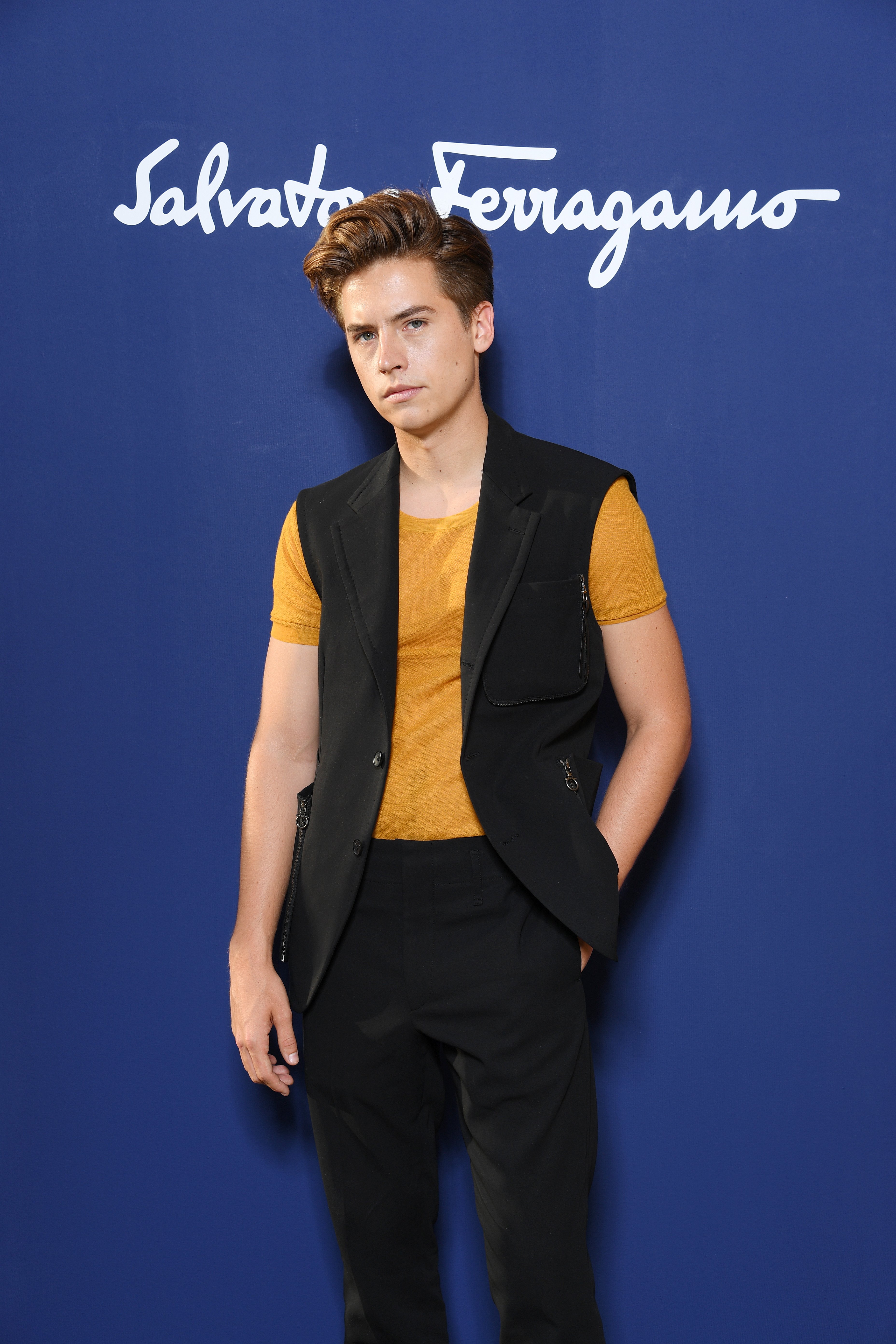 Image Source: Getty Images/Cole posing in an event of Salvatore Ferragamo