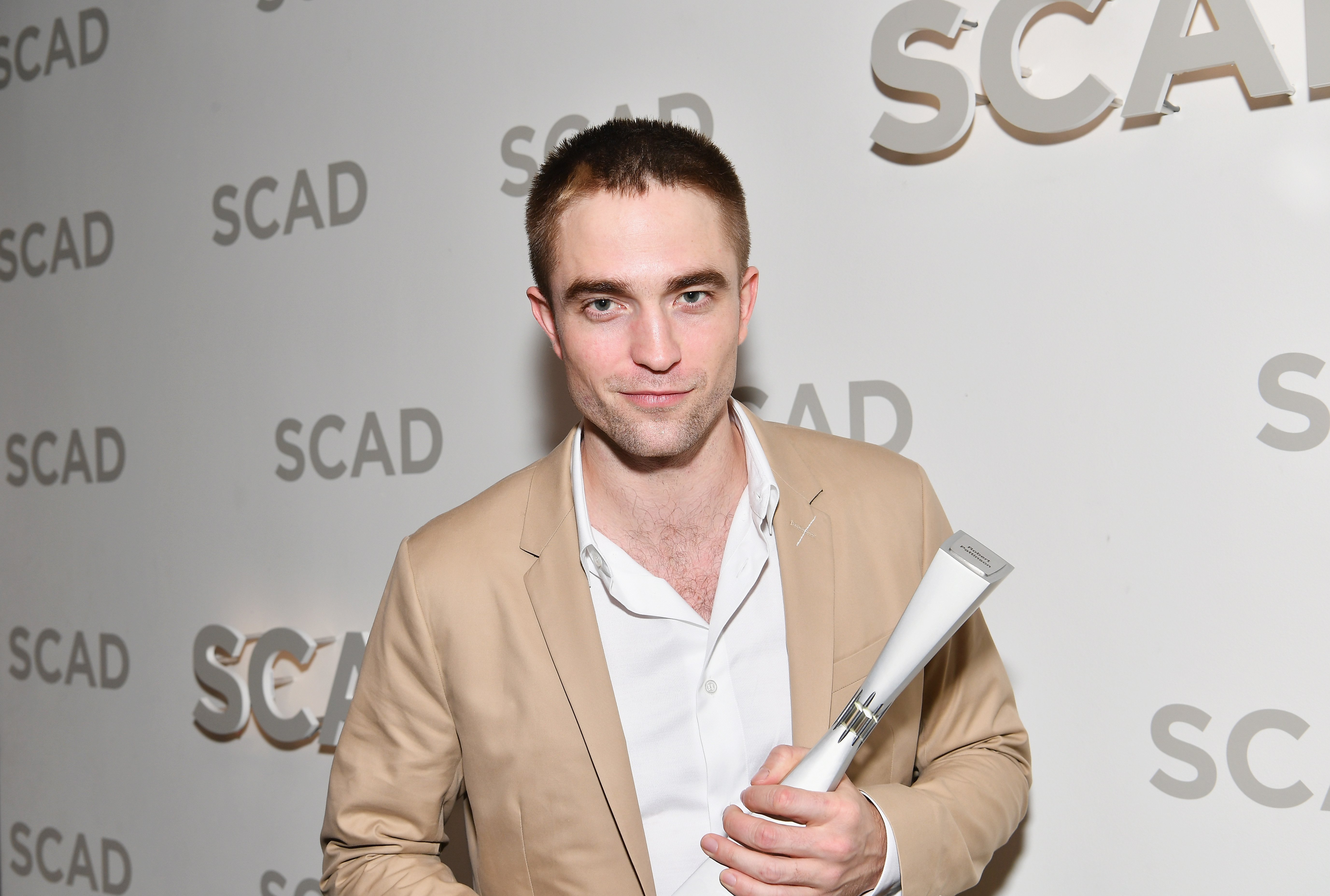 Image Credits: Getty Images / Dia Dipasupil | Actor Robert Pattinson with Maverick Award backstage at Trustees Theater during 20th Anniversary SCAD Savannah Film Festival on November 3, 2017 in Savannah, Georgia. Image Credits: Getty Images / Dia Dipasupil | Actor Robert Pattinson with Maverick Award backstage at Trustees Theater during 20th Anniversary SCAD Savannah Film Festival on November 3, 2017 in Savannah, Georgia.