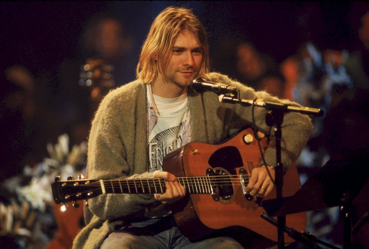 Image Credit: Getty Images / Kurt Cobain performing at a show.