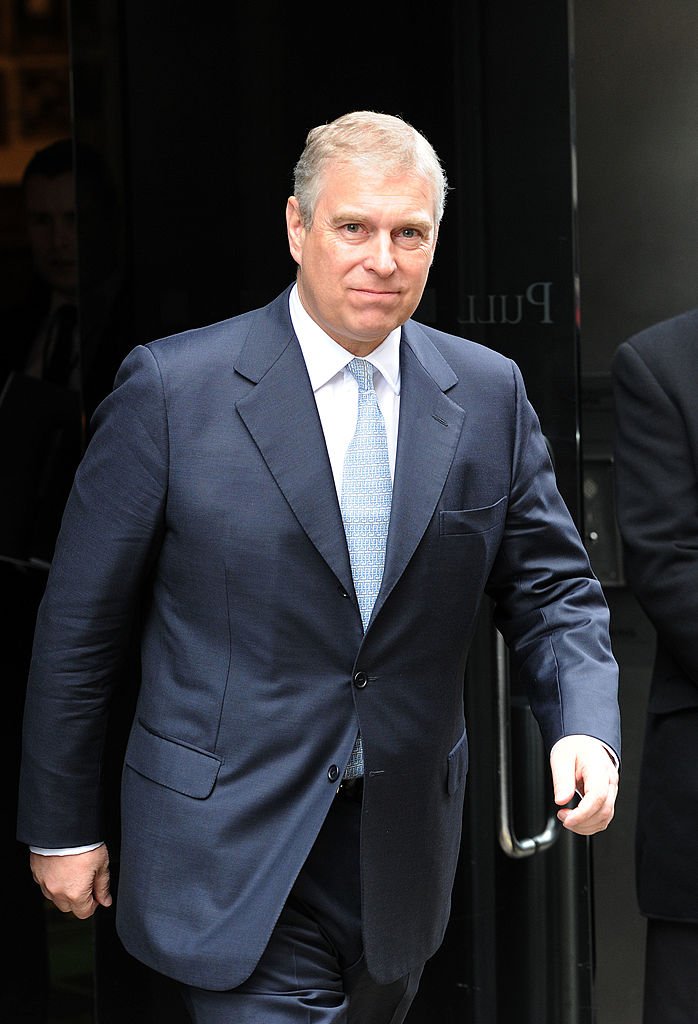 Image Source: Getty Images/ Prince Andrew walking in a suit