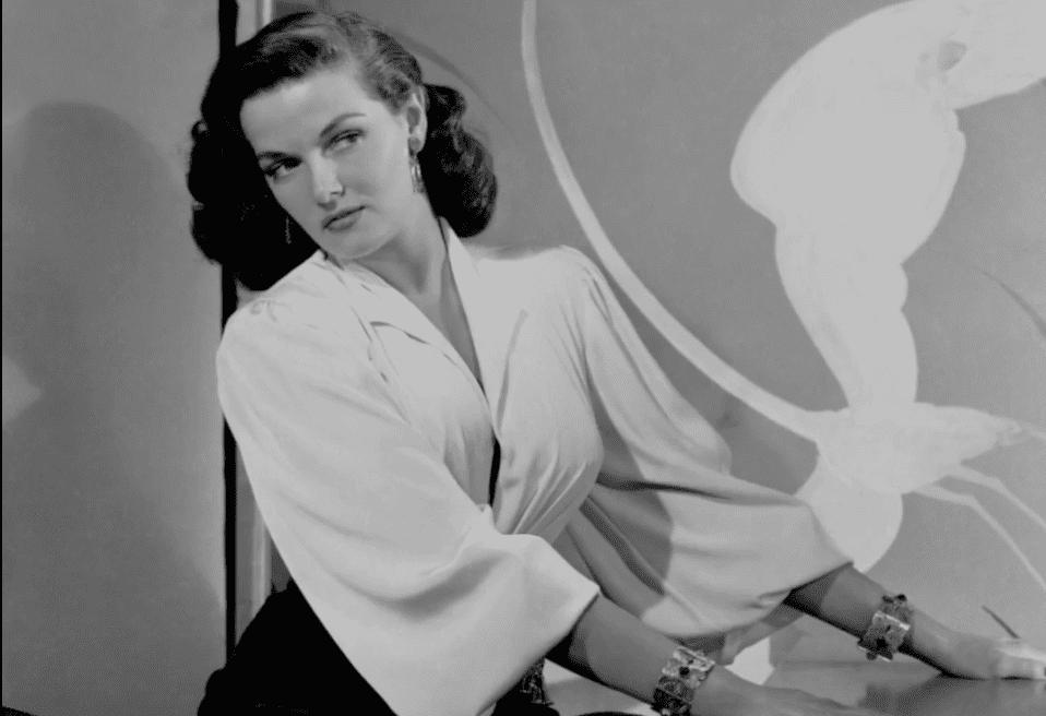 Image Source: Youtube/Cladrite Radio/Jane posing in her white blouse
