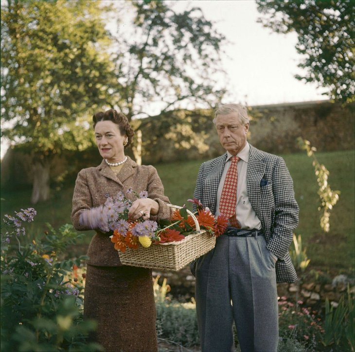 Image Credits: Getty Images / Frank Scherschel / The LIFE Picture Collection | The Duchess and Duke of Windsor pick flowers on the grounds of their home outside of Paris, France, 1955.