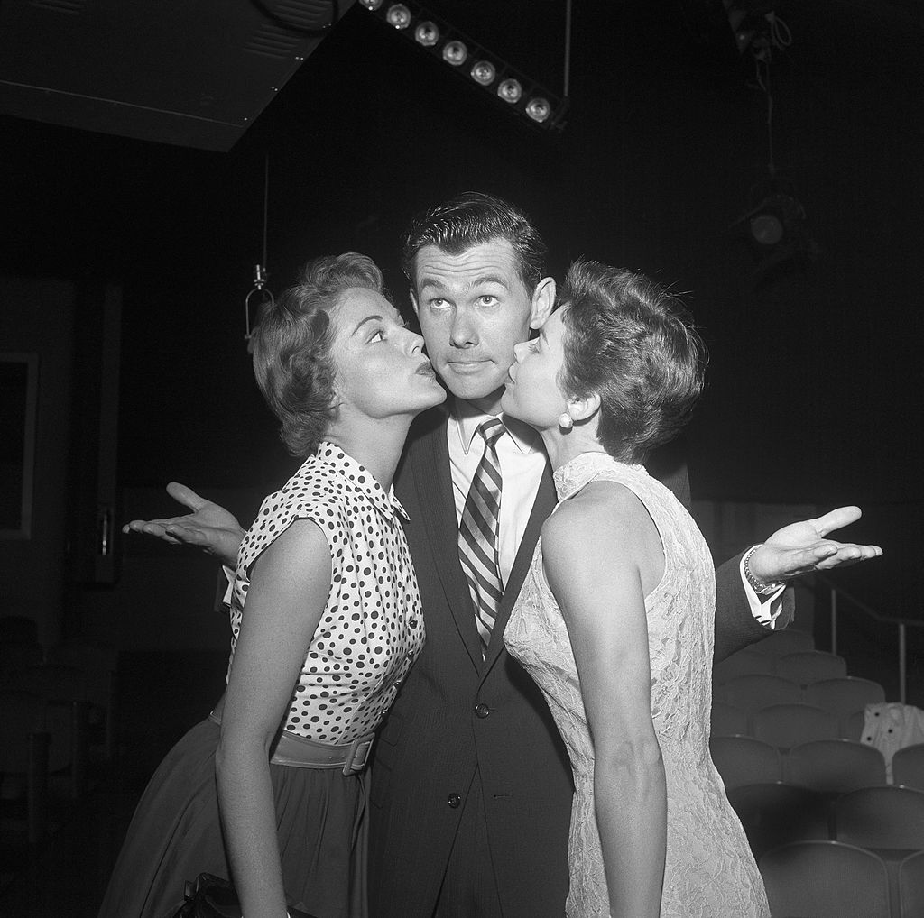Image Credits: Getty Images / Michael Ochs Archives | Johnny Carson With Virginia Gibson left and wife Joan.