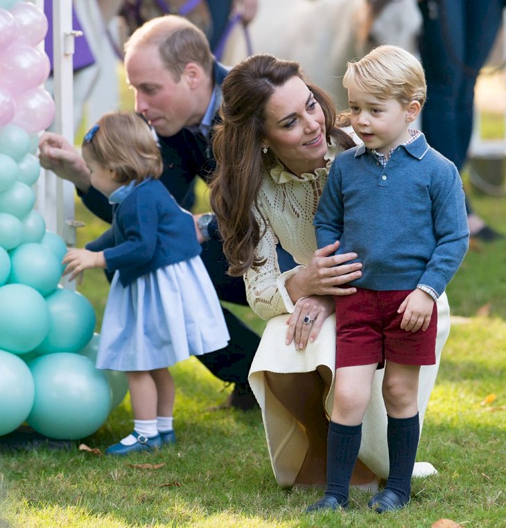 Image Credit: Getty Images / Prince William, Duke of Cambridge, Catherine, Duchess of Cambridge, Prince George of Cambridge and Princess Charlotte of Cambridge attend a children's party for Military families.