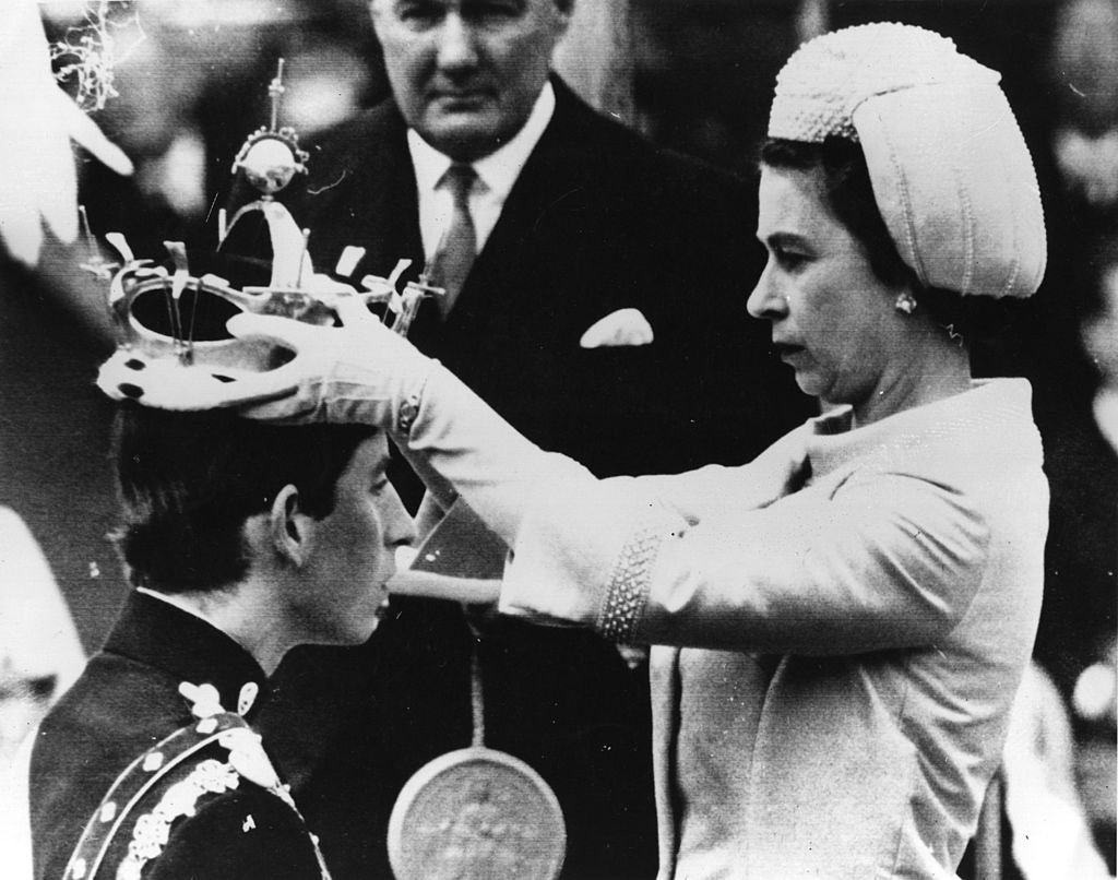 Image Credit: Getty Images / Prince Charles, Prince of Wales, Queen Elizabeth II during the Investiture of Prince Charles as Prince of Wales on July 1, 1969 at Caernafon Castle in Gwynedd, Wales. Image Credit: Getty Images / Prince Charles, Prince of Wales, Queen Elizabeth II during the Investiture of Prince Charles as Prince of Wales on July 1, 1969 at Caernafon Castle in Gwynedd, Wales.