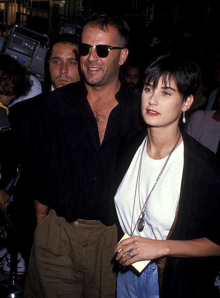 Image Credits: Getty Images / Ron Galella, Ltd. / Ron Galella Collection | Actor Bruce Willis and actress Demi Moore attend the "When Harry Met Sally" Beverly Hills Premiere on July 13, 1989 at the Samuel Goldwyn Theatre in Beverly Hills, California.