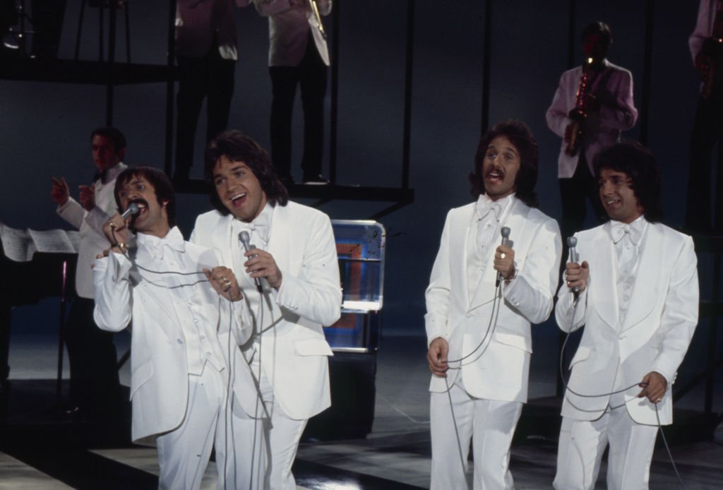 Image Credits: Getty Images / Walt Disney Television | Sonny Bono, Brett Hudson, Mark Hudson, Bill Hudson, the Hudson Brothers appearing on the ABC tv series 'The Sonny Comedy Revue'.
