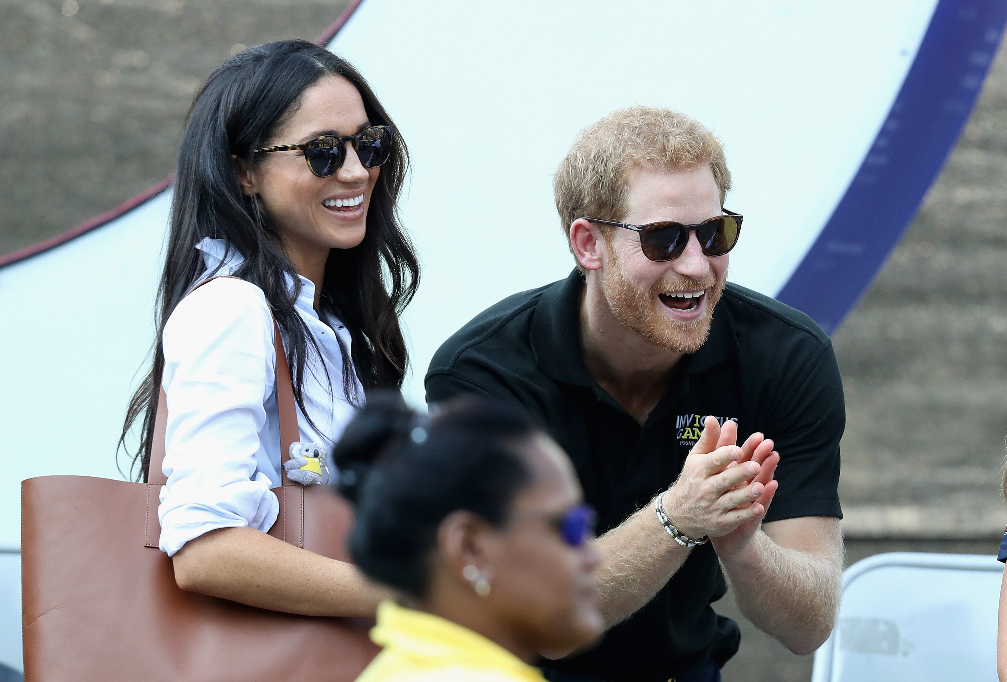 Image Credits: Getty Images / Chris Jackson | Prince Harry (R) and Meghan Markle (L) attend a Wheelchair Tennis match during the Invictus Games 2017 at Nathan Philips Square on September 25, 2017 in Toronto, Canada.