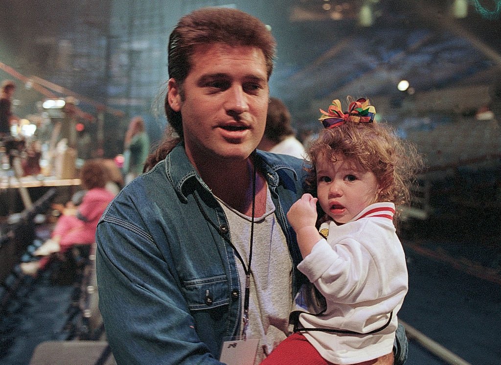 Image Credits: Getty Images / Rick Diamond | Billy Ray Cyrus and Miley Cyrus in 1994