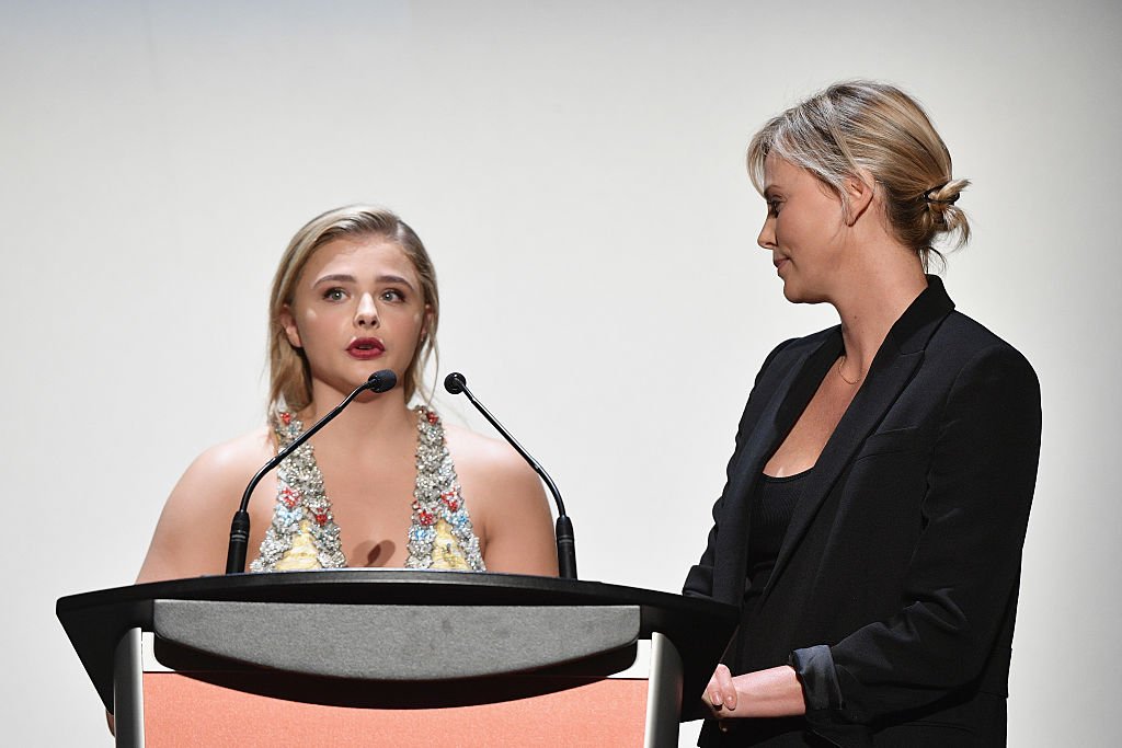 Image Credit: Getty Images / Actresses Chloe Grace Moretz (L) and Charlize Theron on stage during the 2016 Toronto International Film Festival at Princess of Wales Theatre on September 16, 2016.