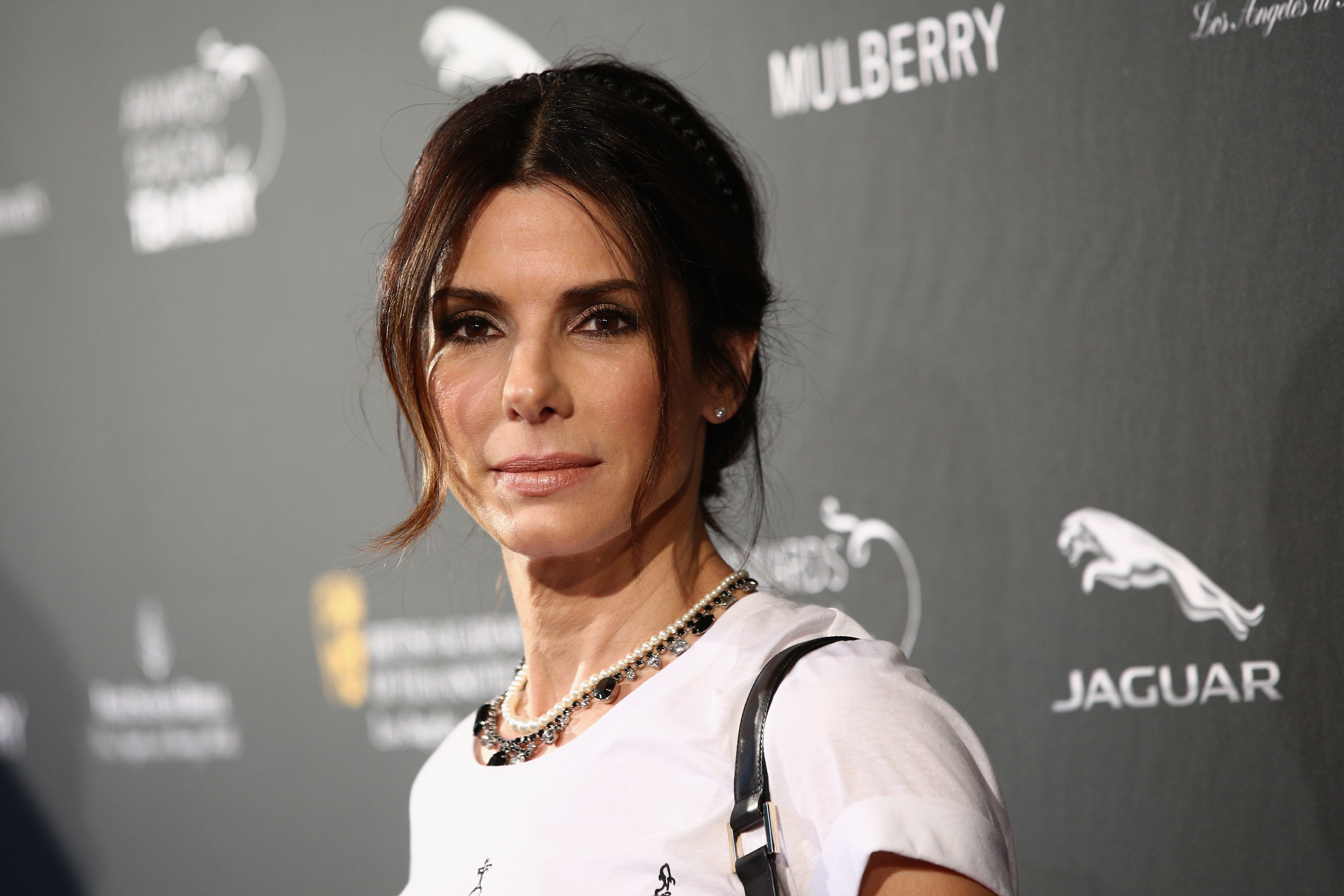 Image Credits: Getty Images / Imeh Akpanudosen | Actress Sandra Bullock attends the BAFTA LA 2014 Awards Season Tea Party at the Four Seasons Hotel Los Angeles at Beverly Hills on January 11, 2014 in Beverly Hills, California.