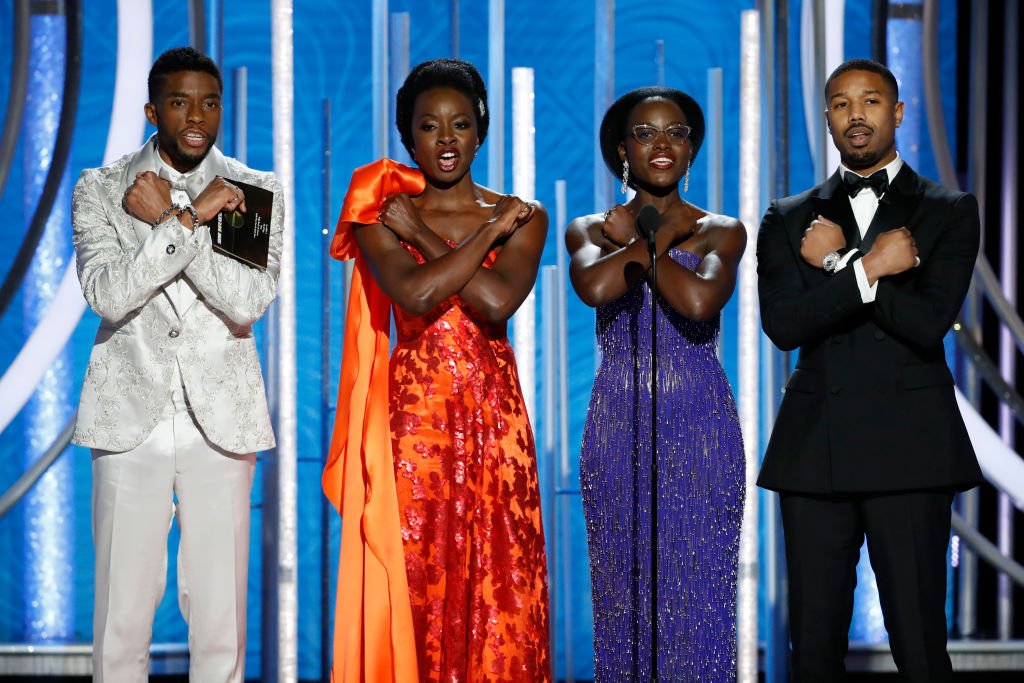 Image Credits: Getty Images / Paul Drinkwater / NBCUniversal | In this handout photo provided by NBCUniversal, Presenters Chadwick Boseman, Danai Gurira, Lupita Nyong'o and Michael B. Jordan speak onstage during the 76th Annual Golden Globe Awards at The Beverly Hilton Hotel on January 06, 2019 in Beverly Hills, California.