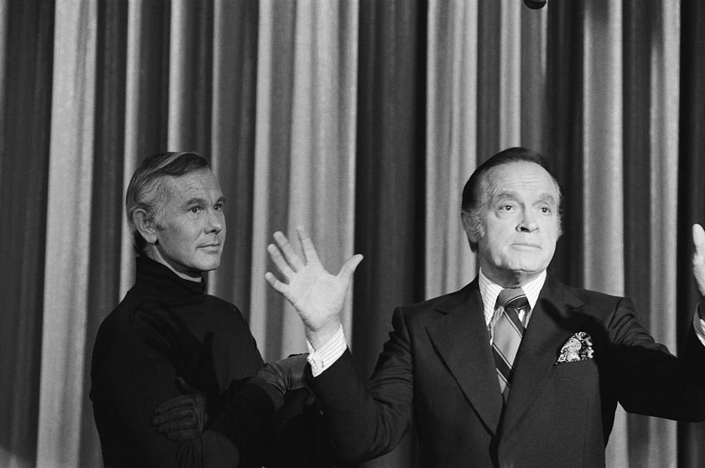 Image Credits: Getty Images / Frank Carroll / NBCU Photo Bank / NBCUniversal | Johnny Carson as The Masked Killer, Bob Hope.