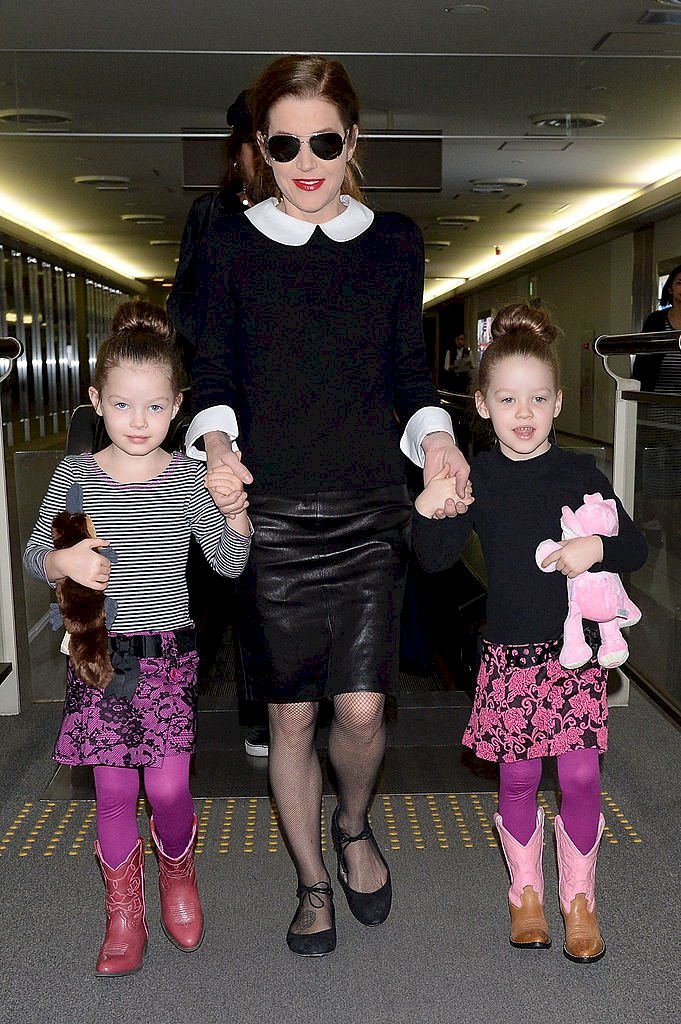 Image Credit: Getty Images / Singer Lisa Marie Presley with her twin daughters Harper Vivienne Ann and Finley Aaron Love arrive at Narita International Airport on April 5, 2014.