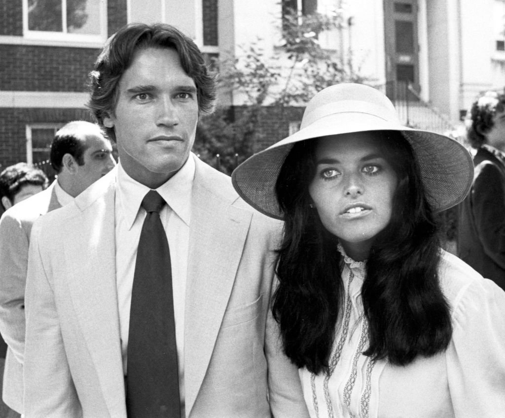 Image Credits: Getty Images / Ron Galella / Ron Galella Collection | Arnold Schwarzenegger and Maria Shriver attend the Courtney Kennedy and Jeff Ruhe Wedding at Holy Trinity Church, Washington D.C., 06/14/80. Image Credits: Getty Images / Ron Galella / Ron Galella Collection | Arnold Schwarzenegger and Maria Shriver attend the Courtney Kennedy and Jeff Ruhe Wedding at Holy Trinity Church, Washington D.C., 06/14/80.