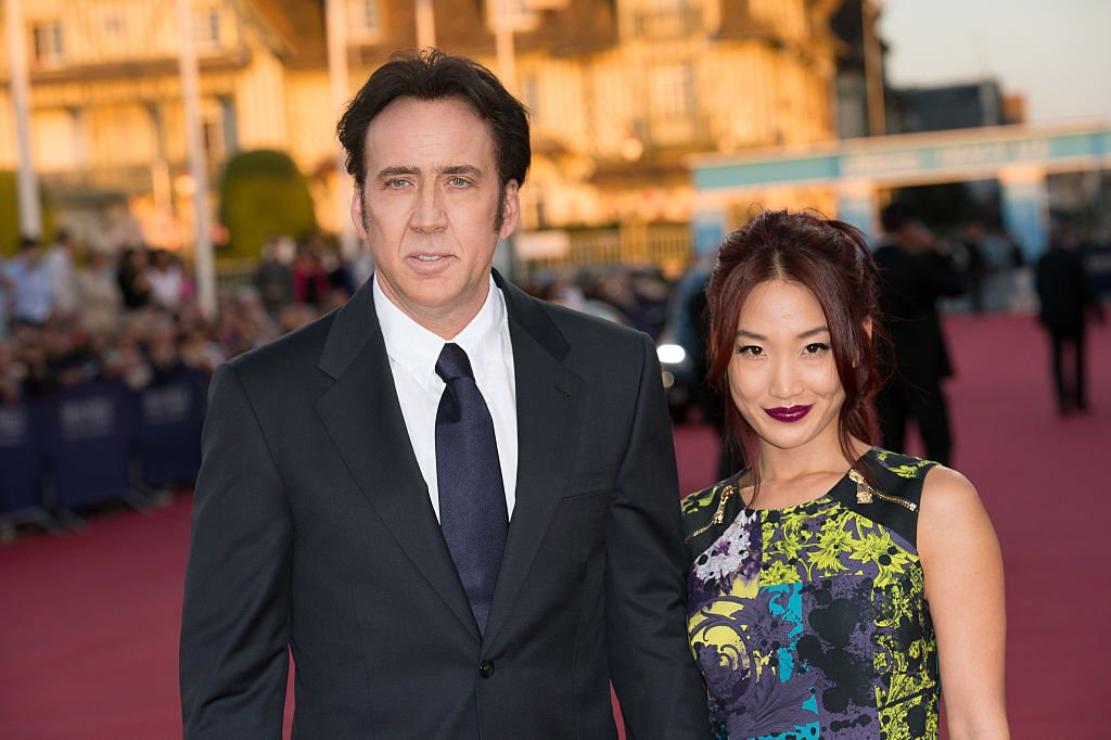 Image Source: Getty Images/Corbis via Getty Images/Stephane Cardinale | Cage and Kim in 2013 Image Source: Getty Images/Corbis via Getty Images/Stephane Cardinale | Cage and Kim in 2013