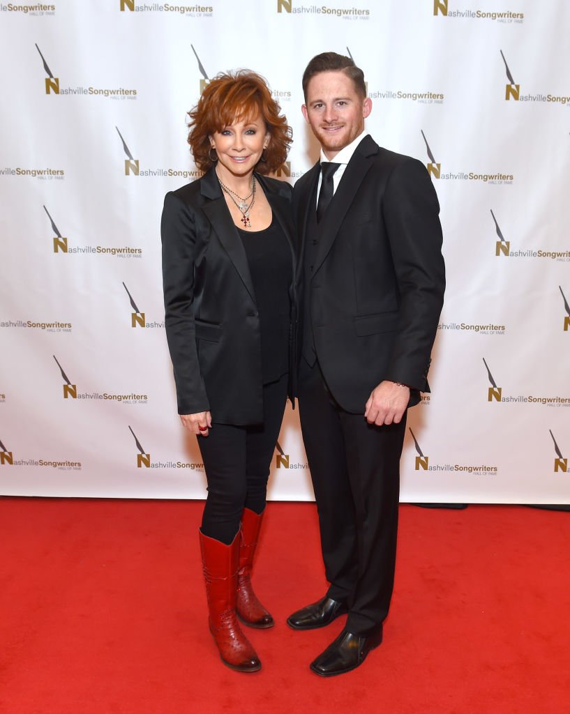Image Credits: Getty Images / Jason Kempin | Reba and her son Shelby Blackstock
