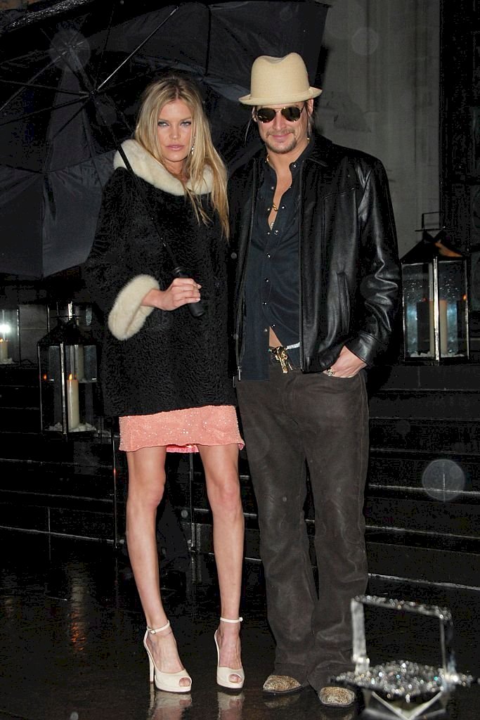 Image Credit: Getty Images/Patrick McMullan via Getty Images/CHANCE YEH | May Anderson and Kid Rock attend SIR ELTON JOHN 60TH BIRTHDAY PARTY