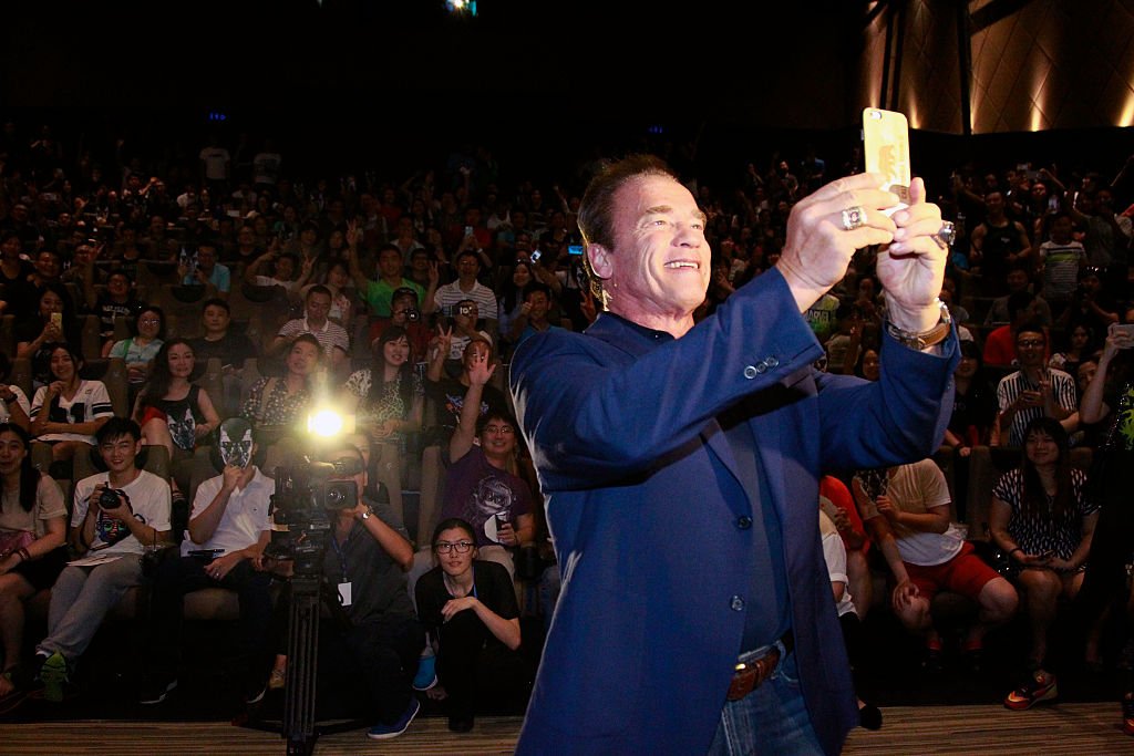 Image Credits: Getty Images / Kevin Lee | Arnold Schwarzenegger takes a selfie with audience at the first screenings of Terminator Genisys at Palace IAPM on August 22, 2015 in Shanghai, China. Image Credits: Getty Images / Kevin Lee | Arnold Schwarzenegger takes a selfie with audience at the first screenings of Terminator Genisys at Palace IAPM on August 22, 2015 in Shanghai, China.