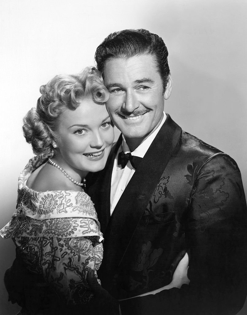 Image Source: Getty Images/Bettmann/Errol Flynn, swashbuckling hero of the motion picture screen, engages in a passionate love scene with Patrice Wymore during the filming of one of their pictures.