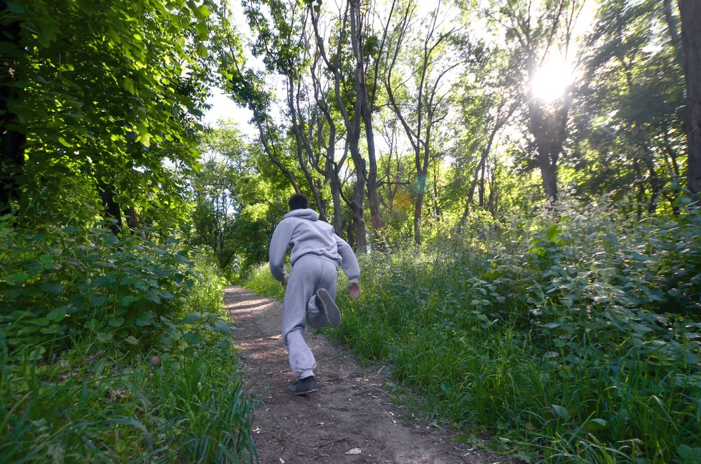 Man runs out of garden | Shutterstock