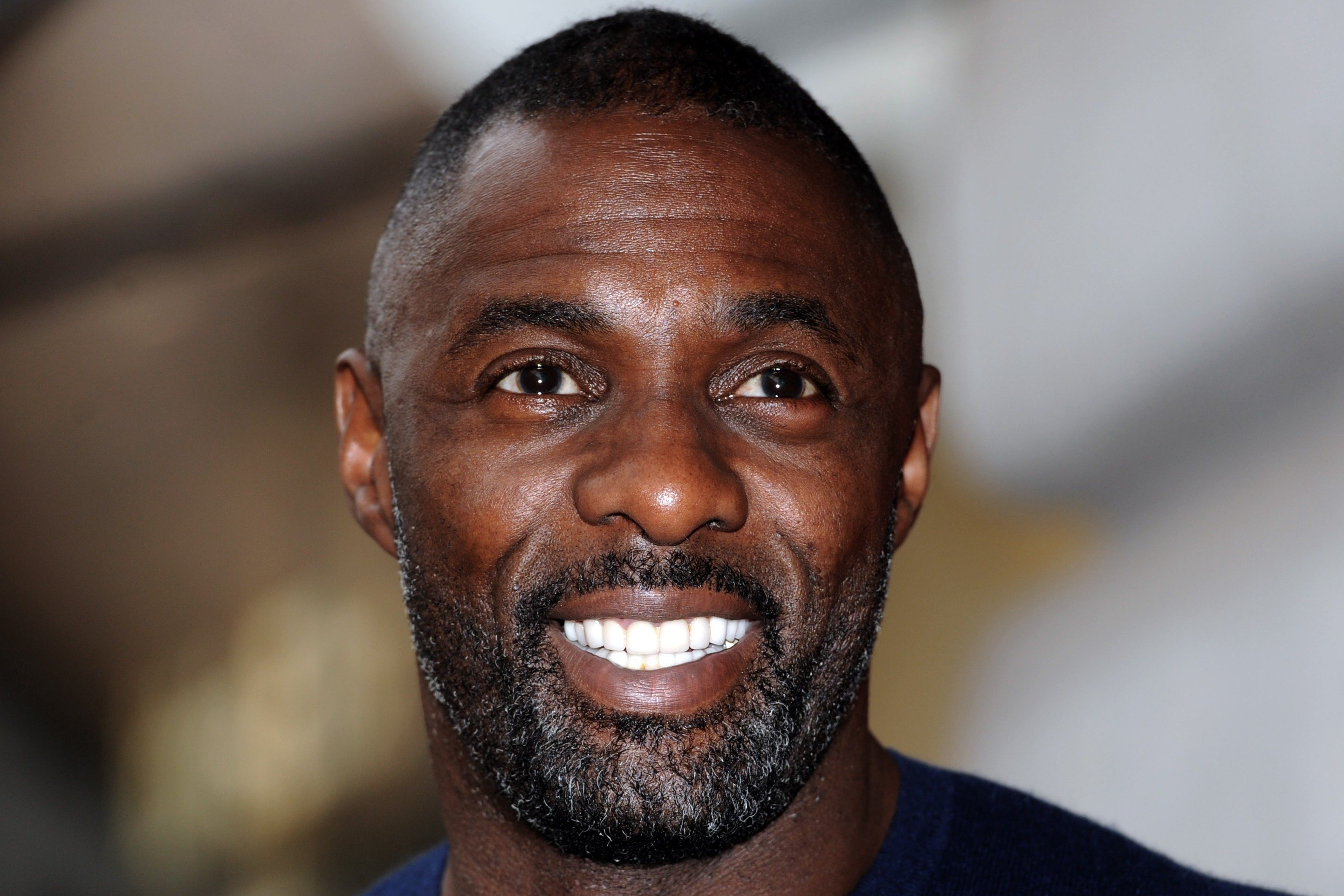 Image Credit: Getty Images/Stuart C. Wilson | Idris Elba attends a photocall to launch the Superdry AW15 Premium Menswear collection