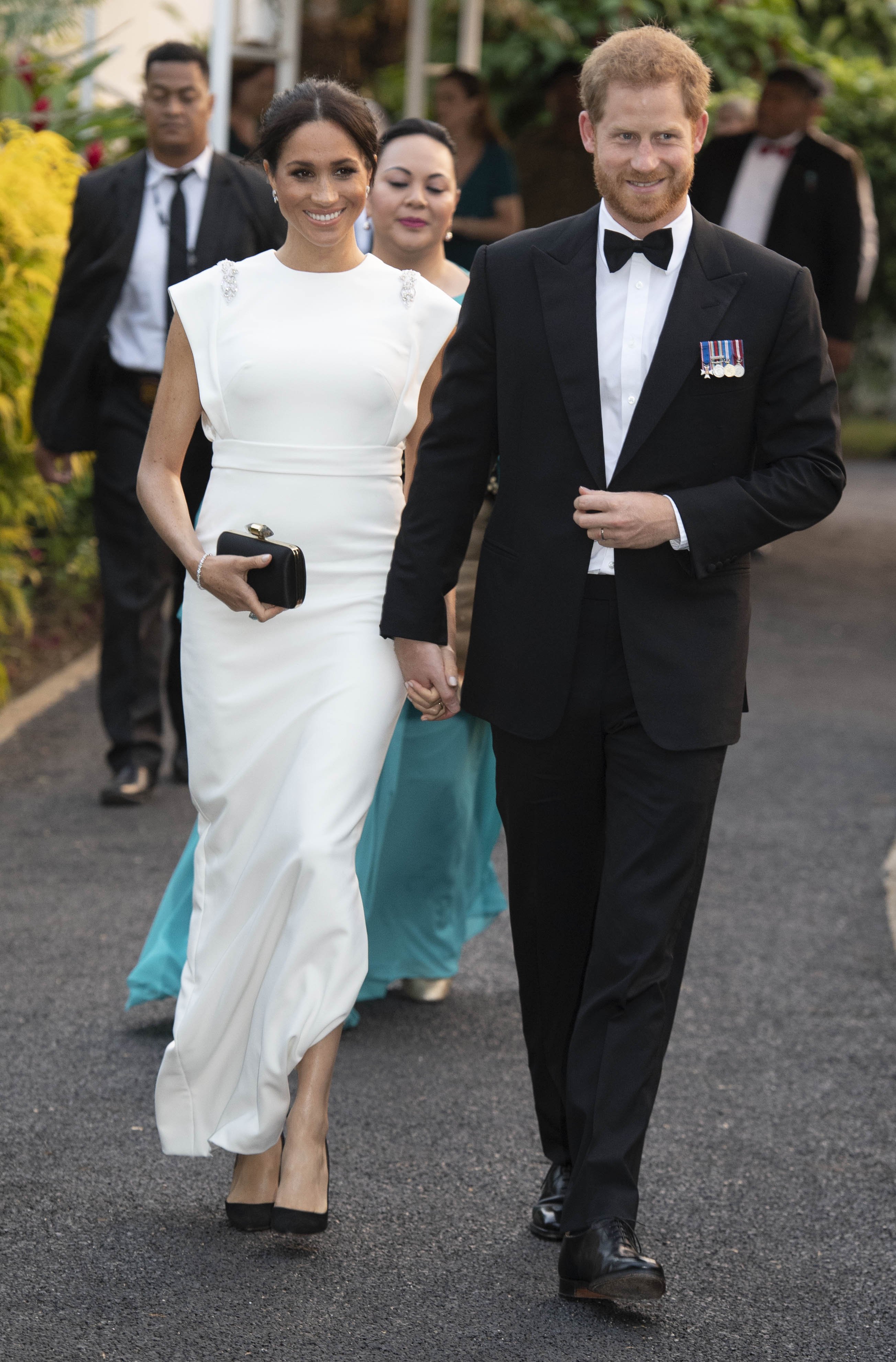 Image Credits: Getty Images | Meghan Markle and Prince Harry are photographed at a royal event.