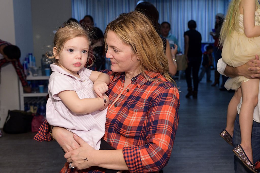 Image Credits: Getty Images / Stefanie Keenan | Drew Barrymore and daughter attend Baby2Baby Holiday Party Presented By The Honest Company at Baby2Baby Headquarters on December 13, 2014 in Los Angeles, California.