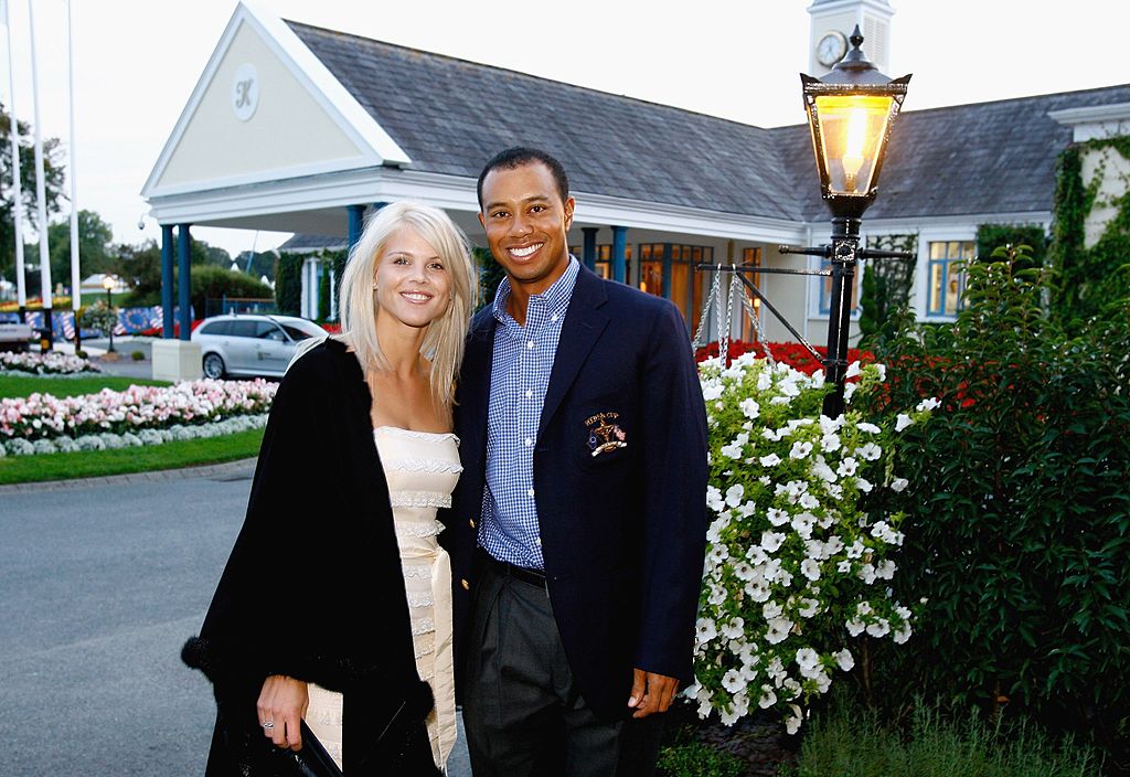 Image Credit: Getty Images / Tiger Woods of USA poses with his wife Elin Nordegren at The Welcome Dinner after the first official practice day of the 2006 Ryder Cup at The K Club on September 19, 2006.