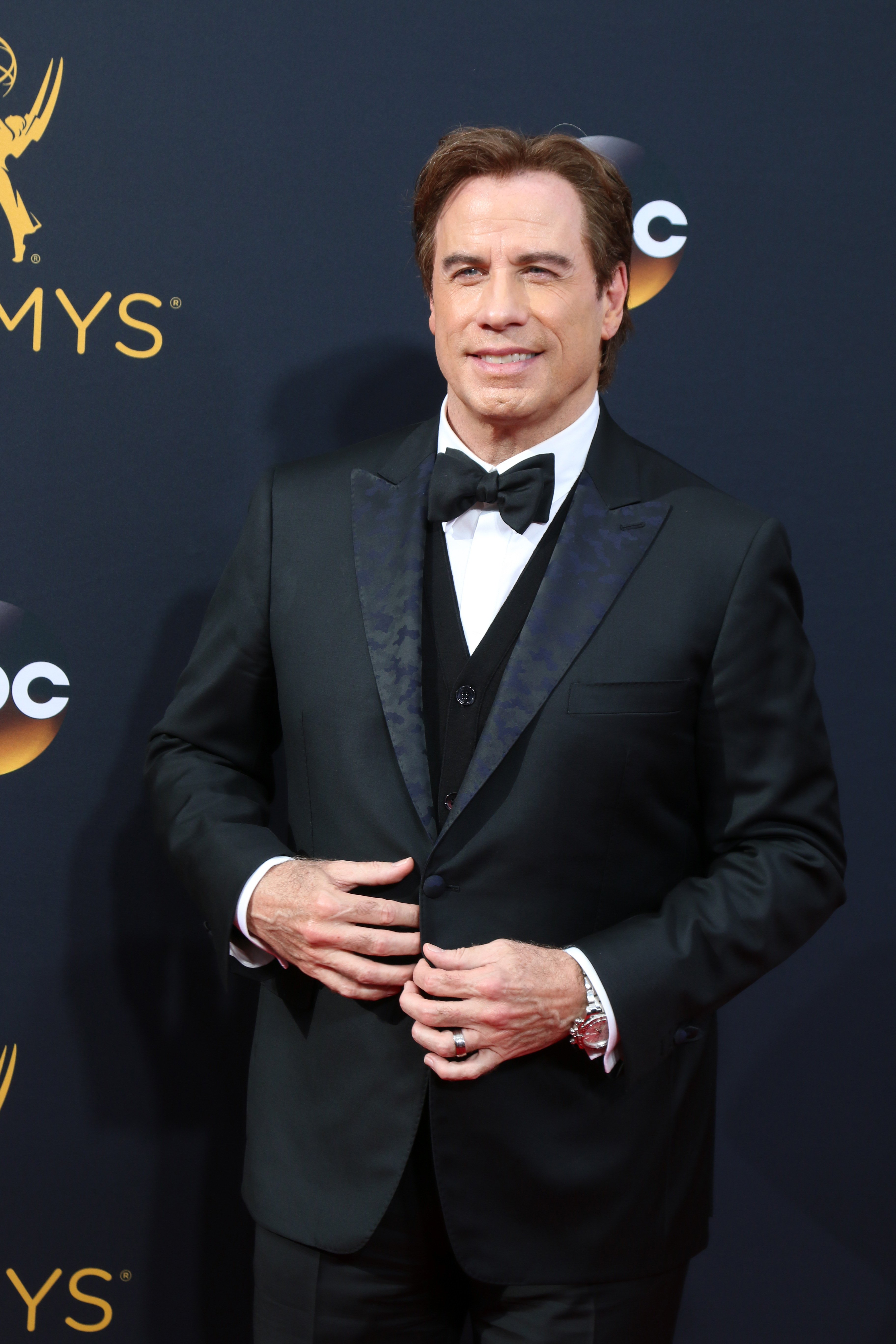 Image Source: Shutterstock/John posing for the camera at the Emmys Image Source: Shutterstock/John posing for the camera at the Emmys