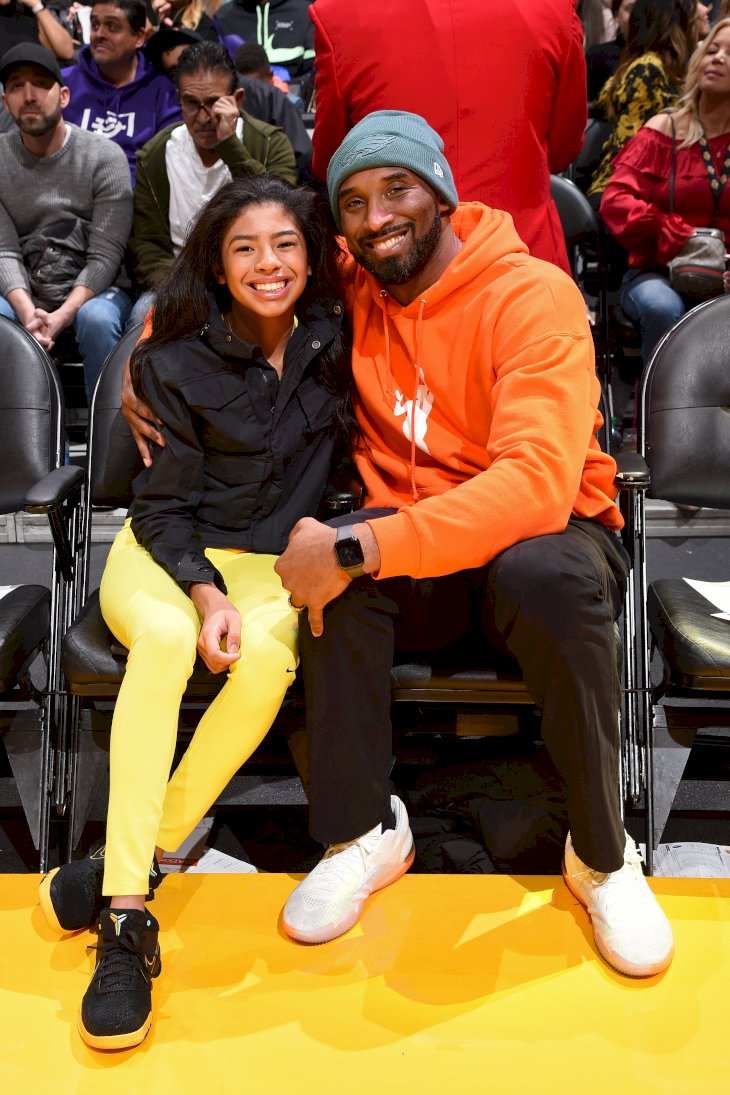 Image Credits: Getty Images / Andrew D. Bernstein / NBAE | Kobe Bryant and Gianna Bryant attend the game between the Los Angeles Lakers and the Dallas Mavericks on December 29, 2019 at STAPLES Center in Los Angeles, California. Image Credits: Getty Images / Andrew D. Bernstein / NBAE | Kobe Bryant and Gianna Bryant attend the game between the Los Angeles Lakers and the Dallas Mavericks on December 29, 2019 at STAPLES Center in Los Angeles, California.