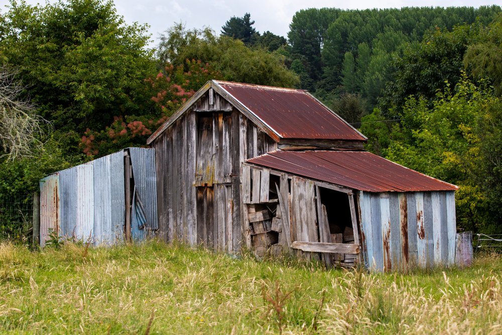 An abandoned shed on a farm | Shutterstock
