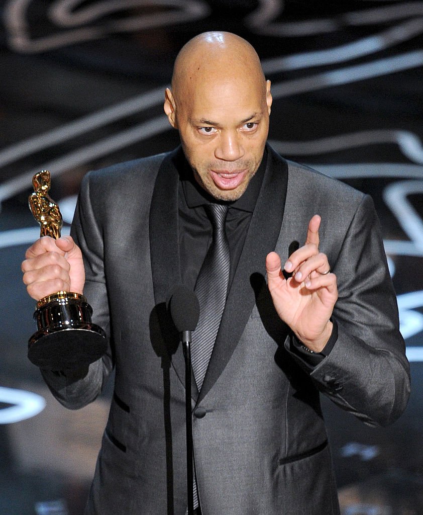 Image Credits: Getty Images / Kevin Winter | Screenwriter John Ridley accepts the Best Screenplay Oscar