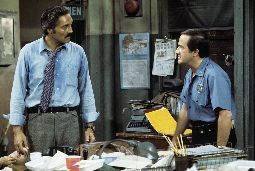 Image Credit: Getty Images / Hal Linden, Ron Carey on set for Barney Miller. Image Credit: Getty Images / Hal Linden, Ron Carey on set for Barney Miller.