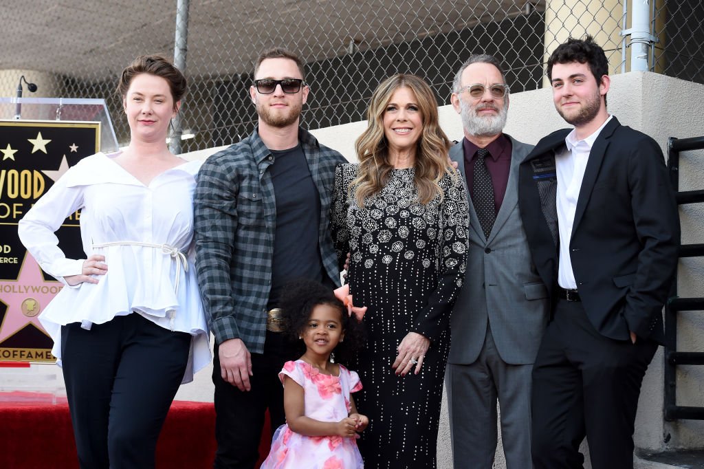 Image Credits: Getty Images / Axelle / Bauer-Griffin / FilmMagic | Chet Hanks (2L), Rita Wilson, Tom Hanks and Truman Hanks attend the ceremony honoring Rita Wilson with Star on the Hollywood Walk of Fame on March 29, 2019 in Hollywood, California.