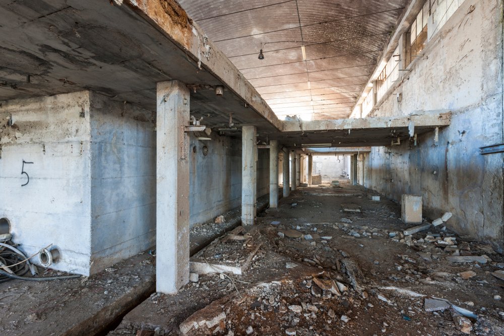 Urban exploration in an abandoned paper mill | Shutterstock Urban exploration in an abandoned paper mill | Shutterstock