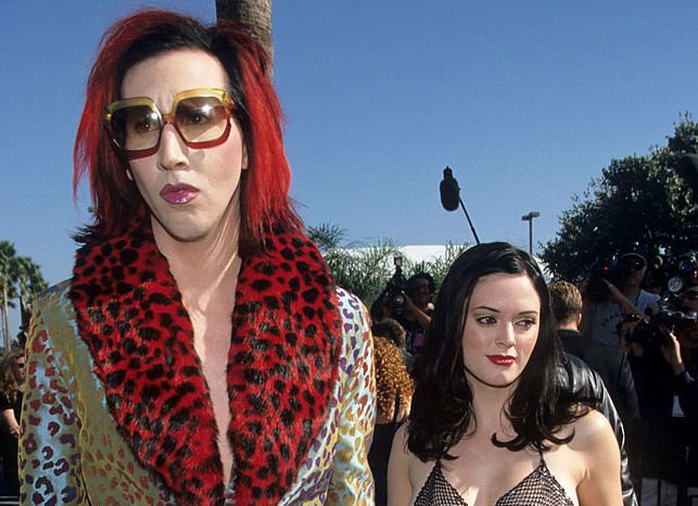 Image Credit: Getty Images / Marilyn Manson and girlfriend actress Rose Mac Gowan arrive at the MTV music awards in 1998.